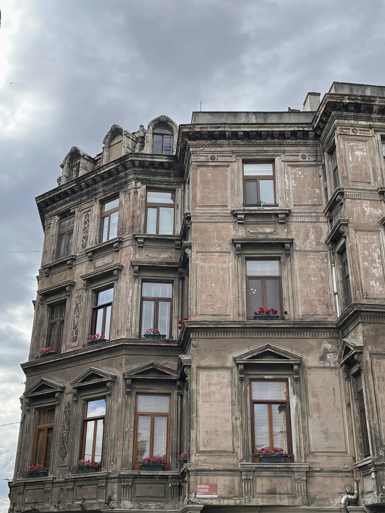 Weathered historic facade against an overcast sky